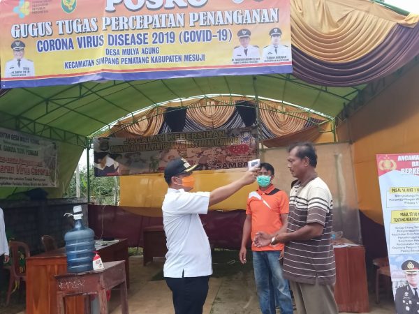 Bakti Sosial Disinpektan Corona Desa Mulya Agung Terapkan Satu Pintu Keluar Masuk Desa