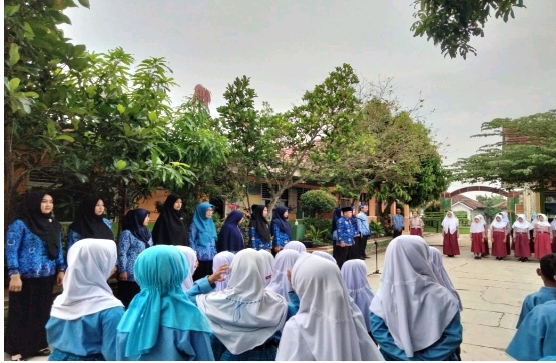 UPT SD Negeri 1 Podomoro MelaksanakanĀ Upacara Memperingati Hari Pendidikan Nasional